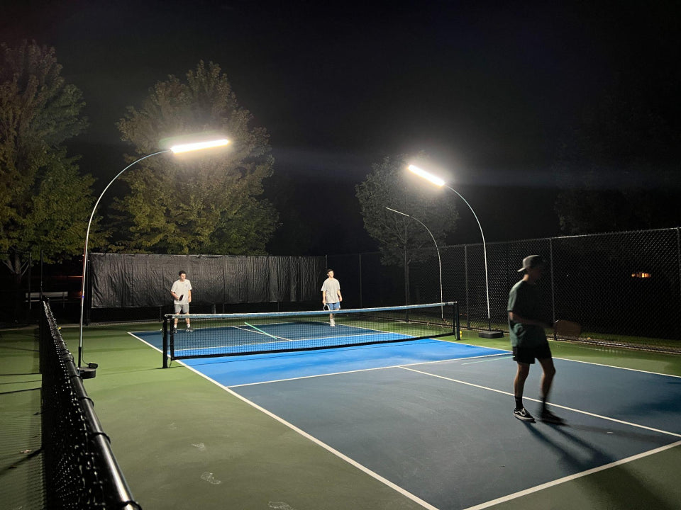 Pickleball court lit up for a night game