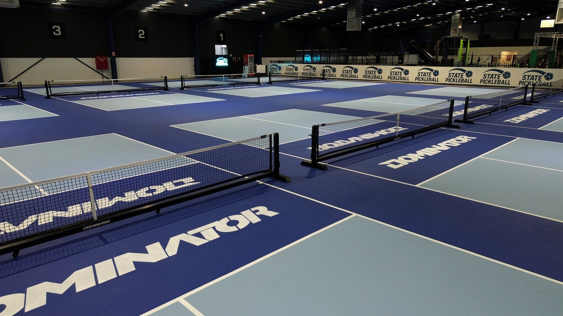 Dominator pickleball nets on branded courts at State Pickleball Centre