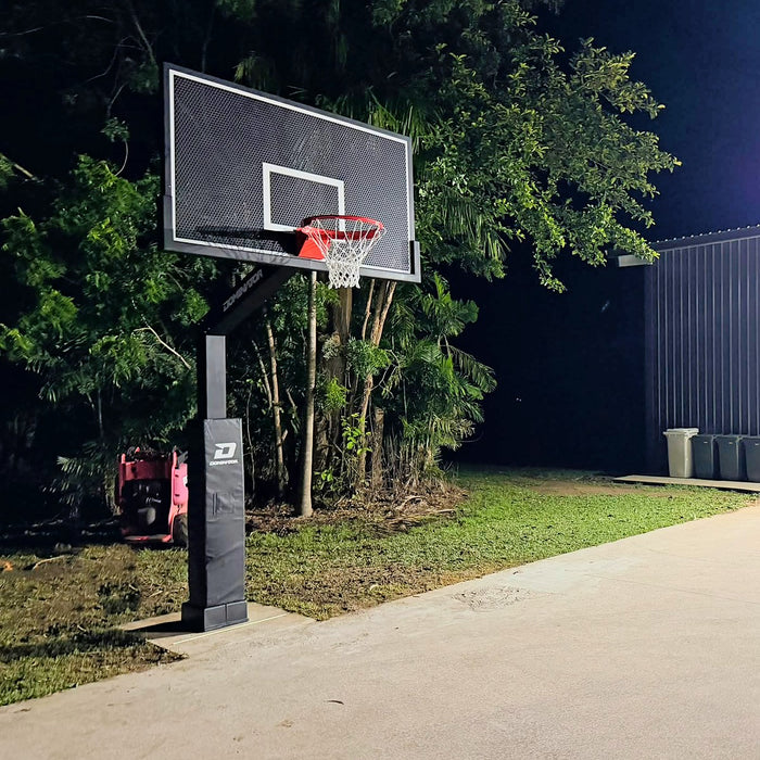 Dominator Pro 72 inch basketball hoop with perforated aluminium backboard installed on a school court